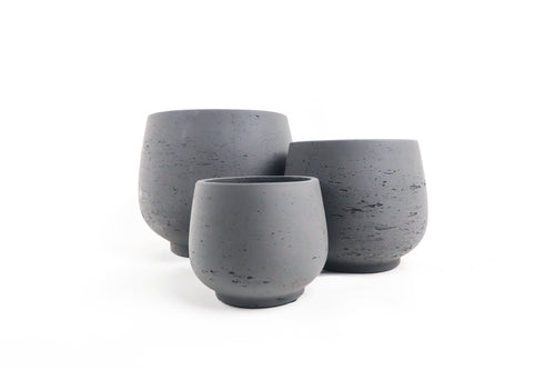 Conservatory Archives Plant Pots, Planter Menhir dark. Concrete planter with a pedestal base.