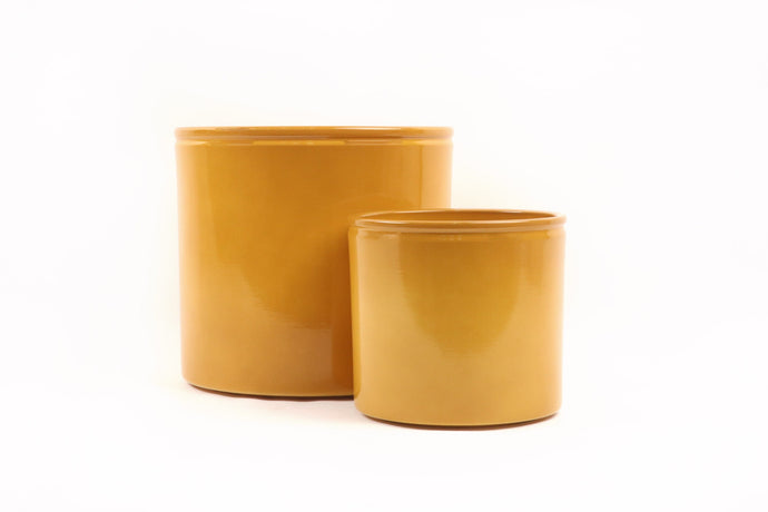 Conservatory Archives Plant Pots, Planter Ruto Yellow. Cylindrical planter with a yellow glazed finish.