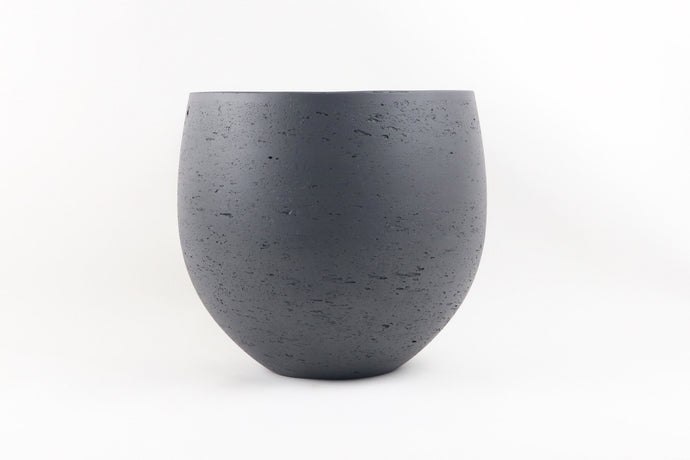 Conservatory Archives Plant Pots, Planter Rutile. Curved planter with a concrete dark finish.