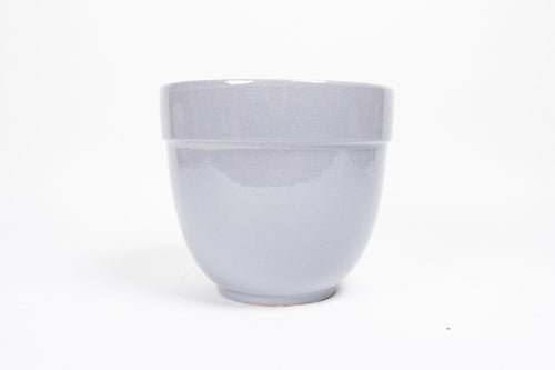 Conservatory Archives Plant Pot, Planter Blue Drift. Curved planter with a soft blue glaze.